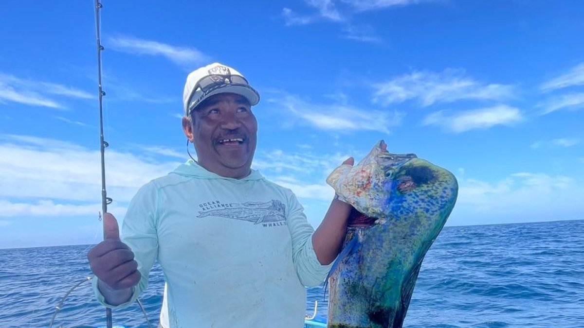 Captain holding a dorado on the Loreto Star panga off the islands of Loreto